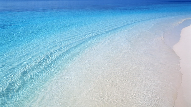 A beach with clear turquoise water and white sand. - The Orient Beach Boracay (Boracay Island)