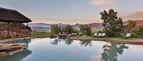 Outdoor pool, pool umbrellas, sun loungers