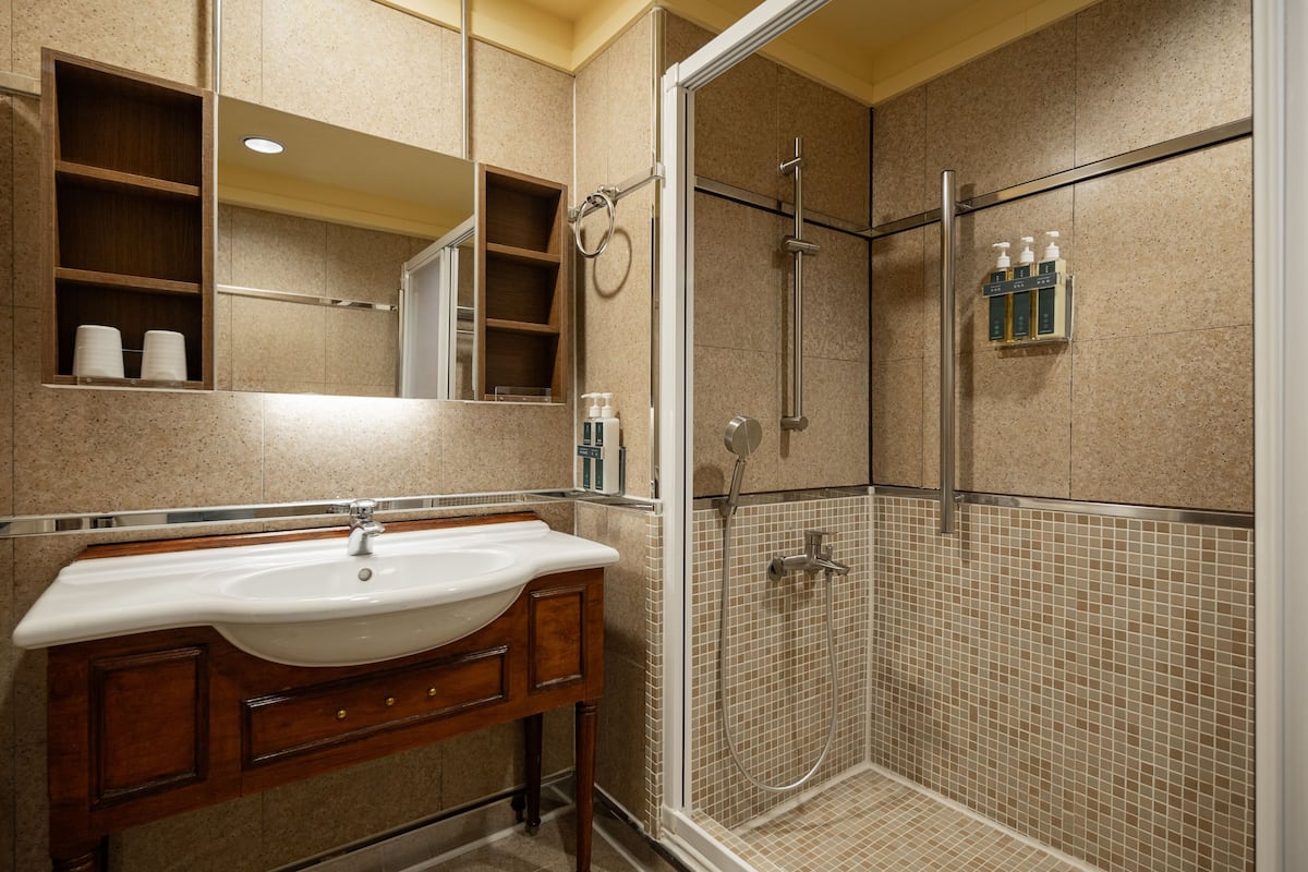 shower, hair dryer, slippers, bidet
