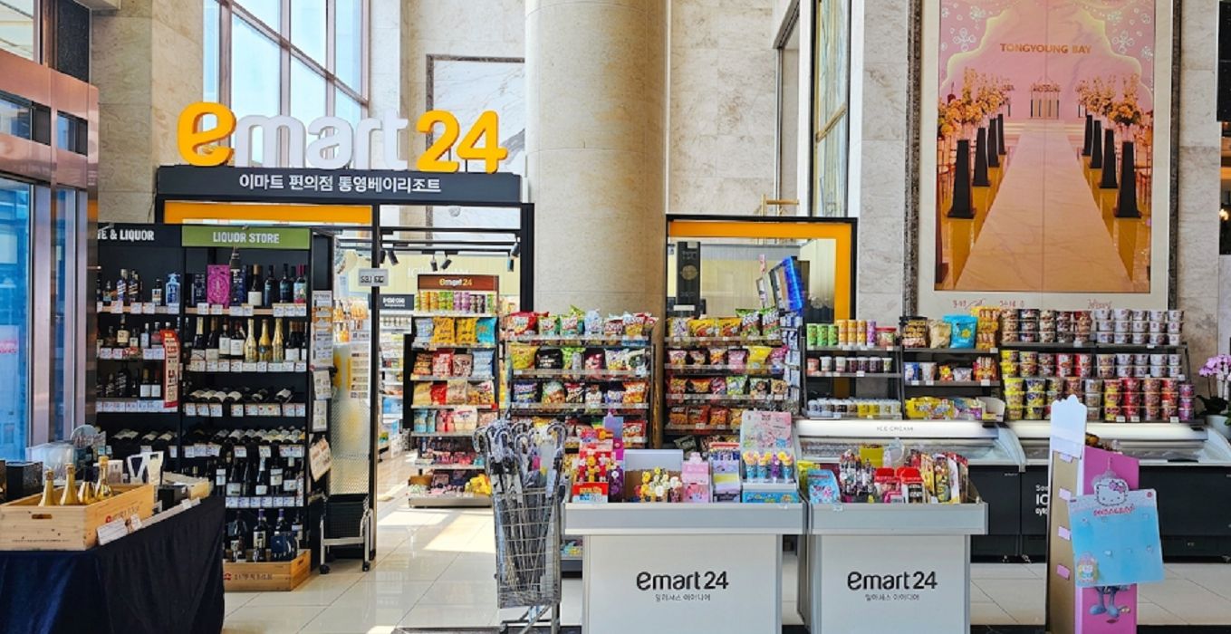 A 24-hour convenience store with shelves stocked with snacks, beverages, and other items.