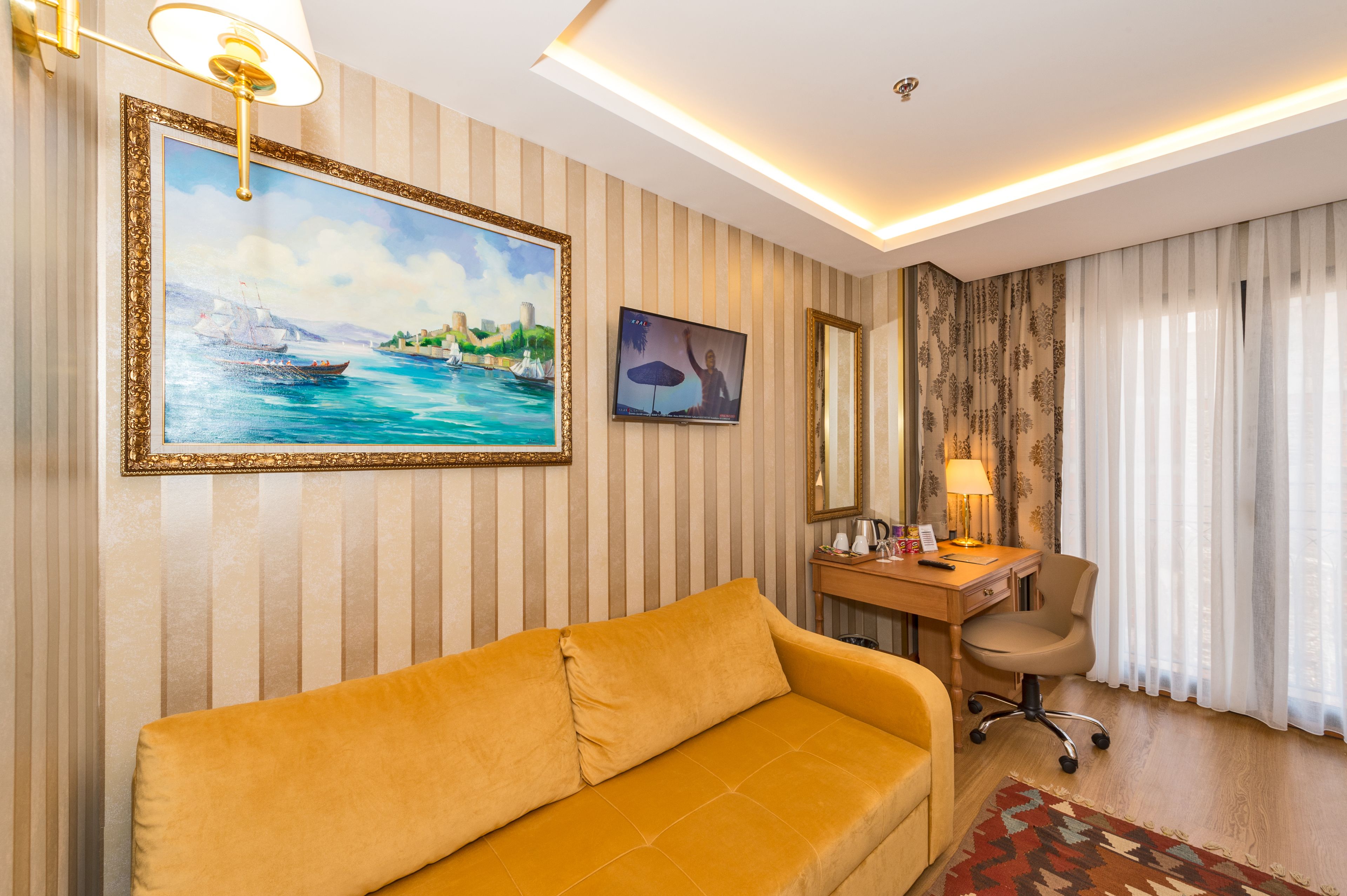 standard double or twin room | living area | lcd tv
