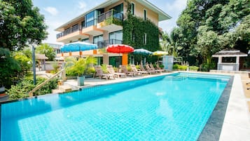 Outdoor pool, open 9:00 AM to 8:00 PM, pool umbrellas, pool loungers