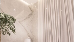 A modern room with a marble wall, a large window with sheer curtains, two sofas, a side table, and a floor lamp. - Riverview Suites Taipei (Taipei)