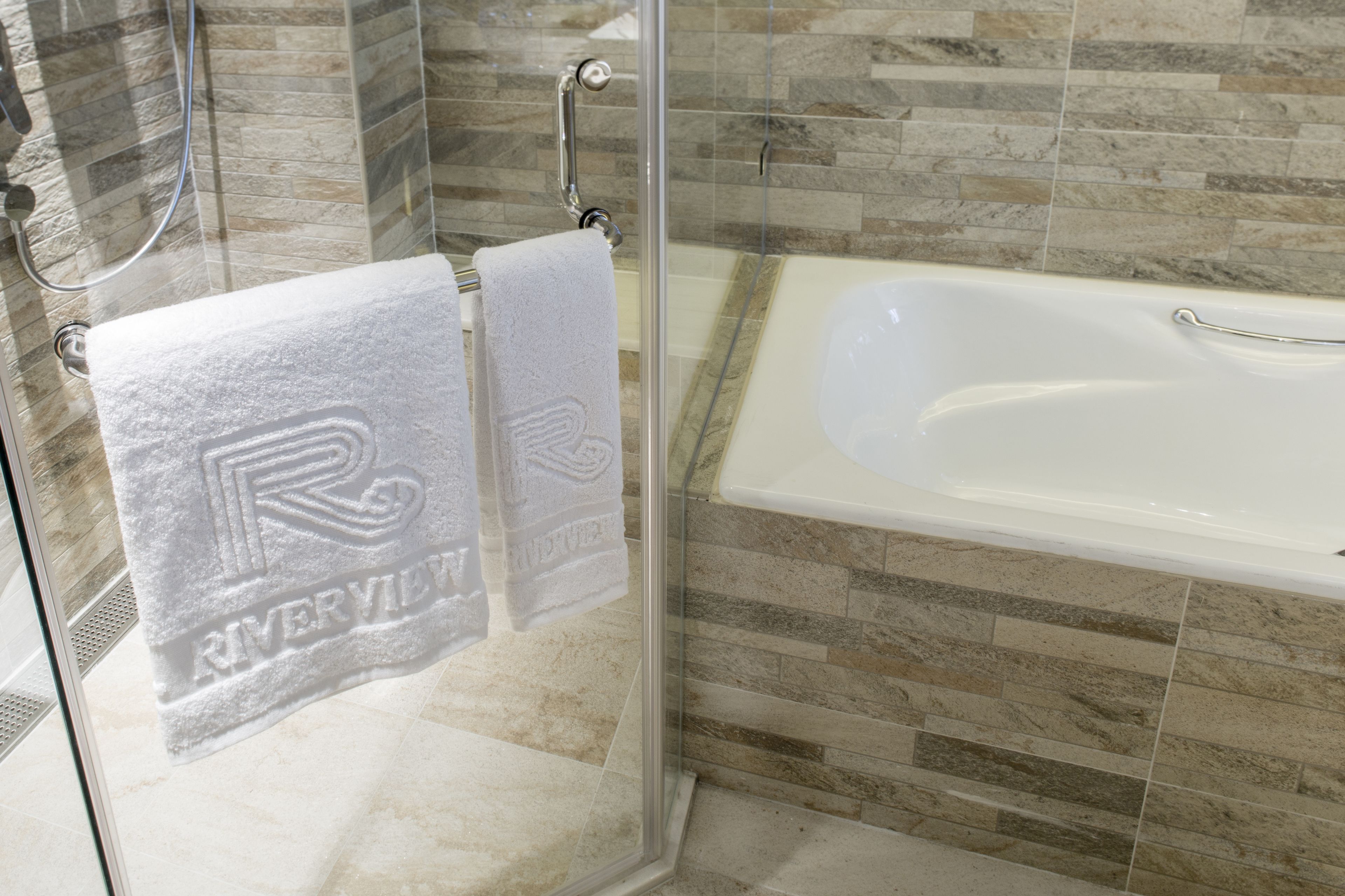 separate bathtub and shower, deep-soaking bathtub, rainfall showerhead