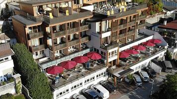 Guests can enjoy outdoor space from every floor, with a covered area below for dining or lounging.