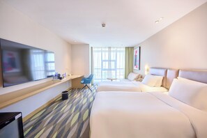 A hotel room with two beds, a flat-screen TV, a desk with a chair, and a window with curtains. - Holiday Inn Express Changzhou Lanling by IHG (Changzhou)