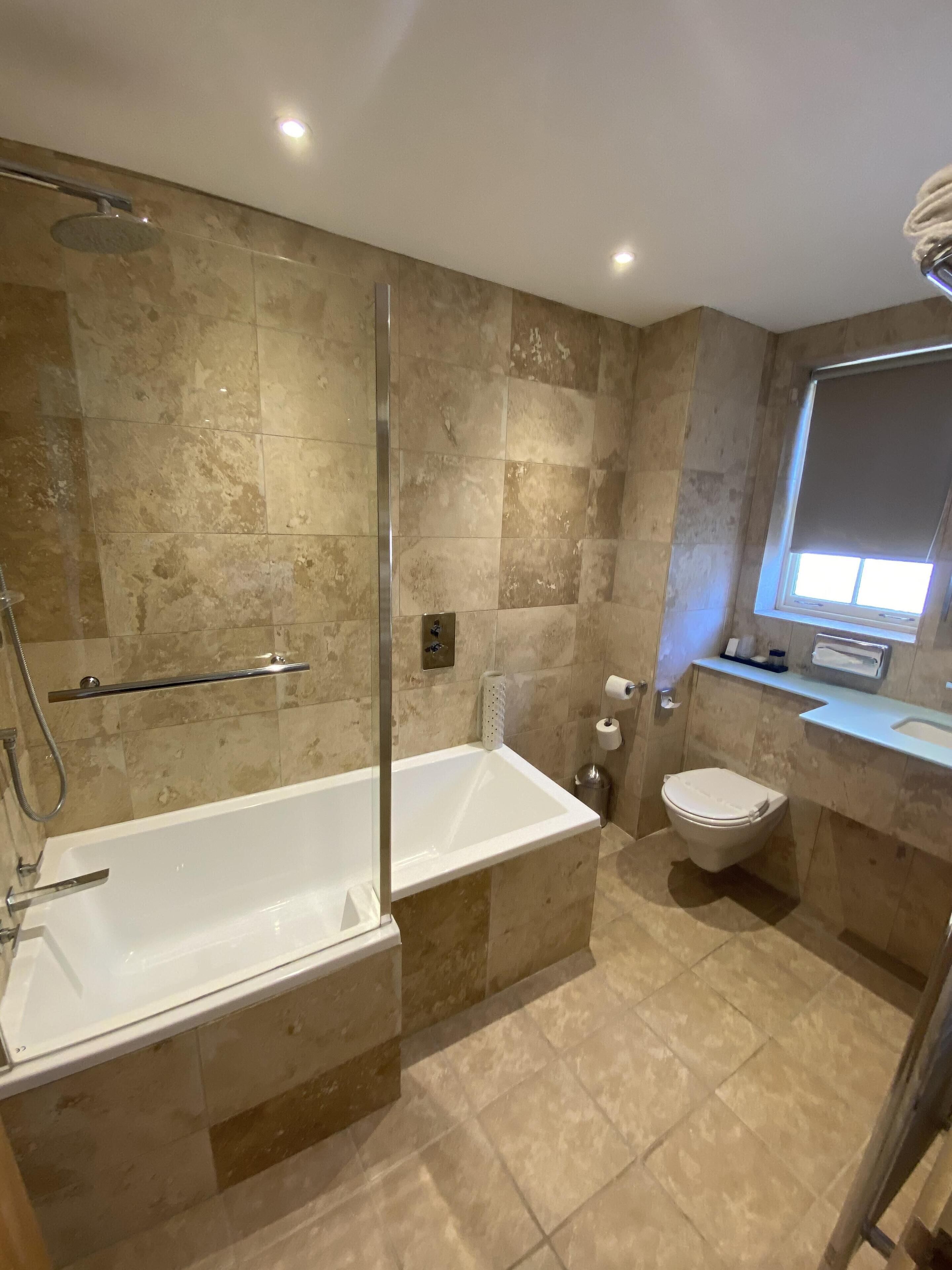 family suite | bathroom | shower, free toiletries, hair dryer, towels