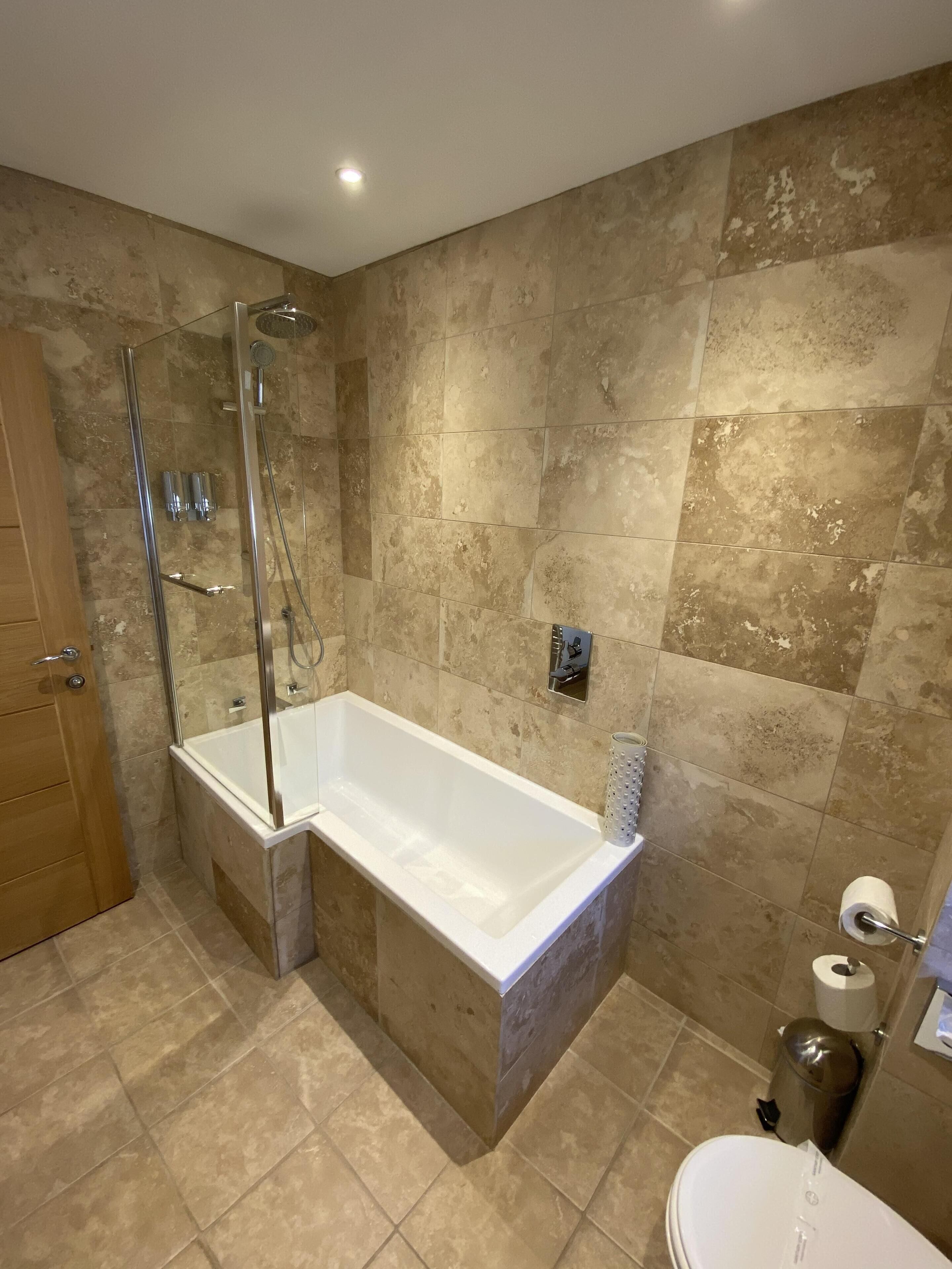 family suite | bathroom | shower, free toiletries, hair dryer, towels