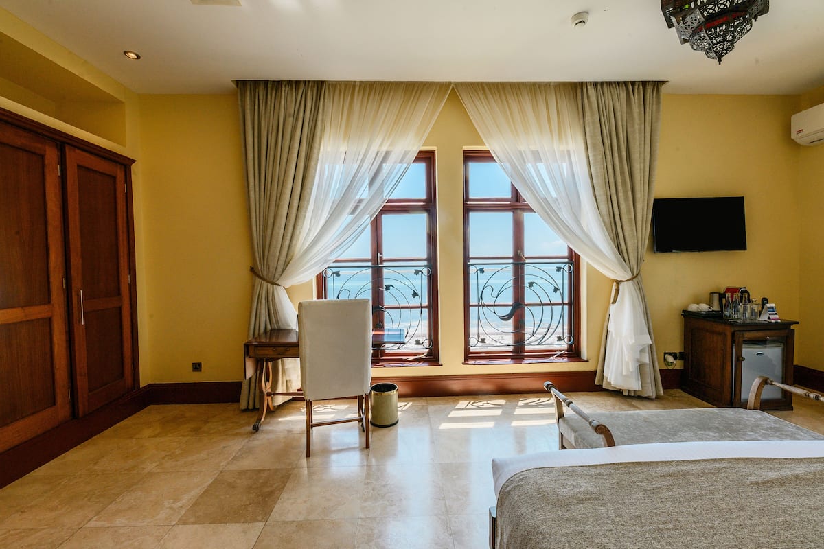 superior suite, 1 king bed, sea view | premium bedding, minibar, in-room safe, desk