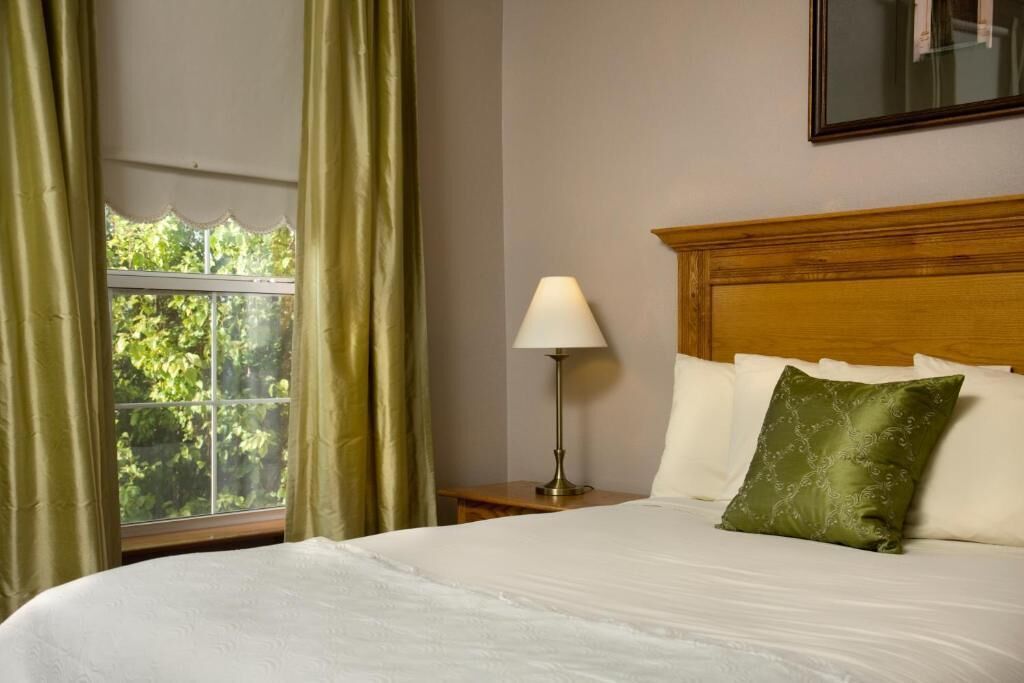 premium bedding, pillow-top beds, desk, laptop workspace