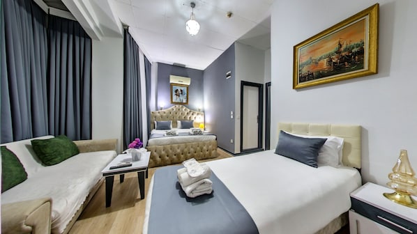 Deluxe Quadruple Room, Non Smoking, Balcony | Egyptian cotton sheets, premium bedding, down comforters, free minibar