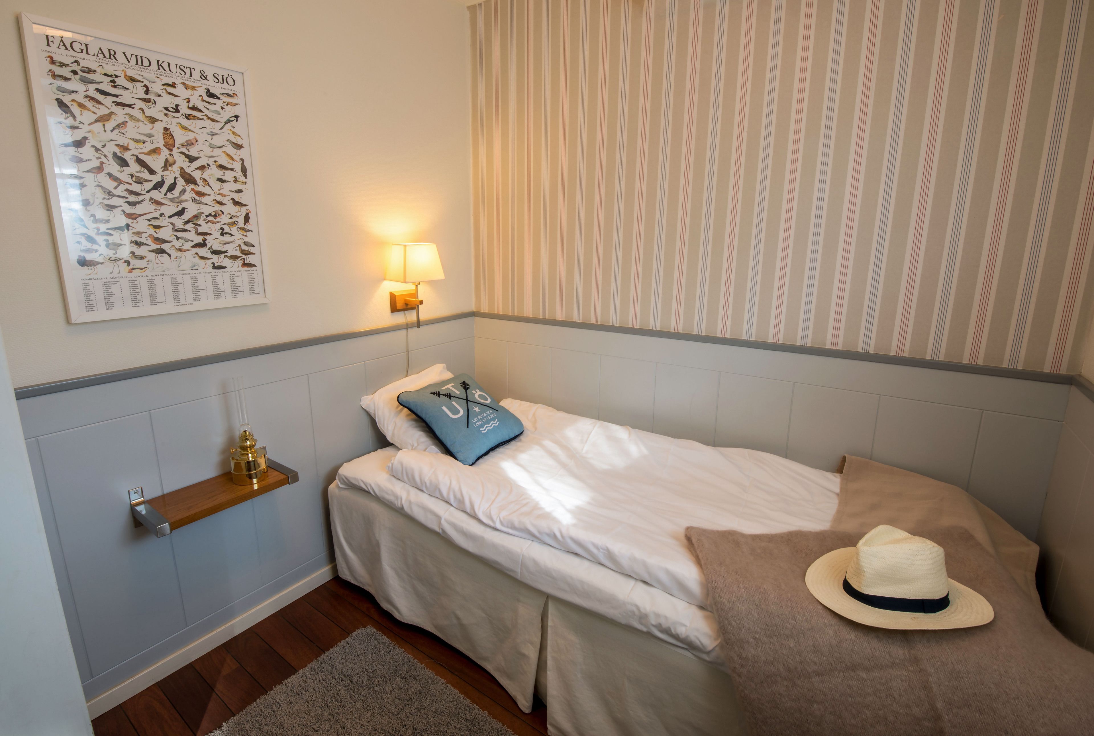 family room | desk, iron/ironing board, cots/infant beds, bed sheets