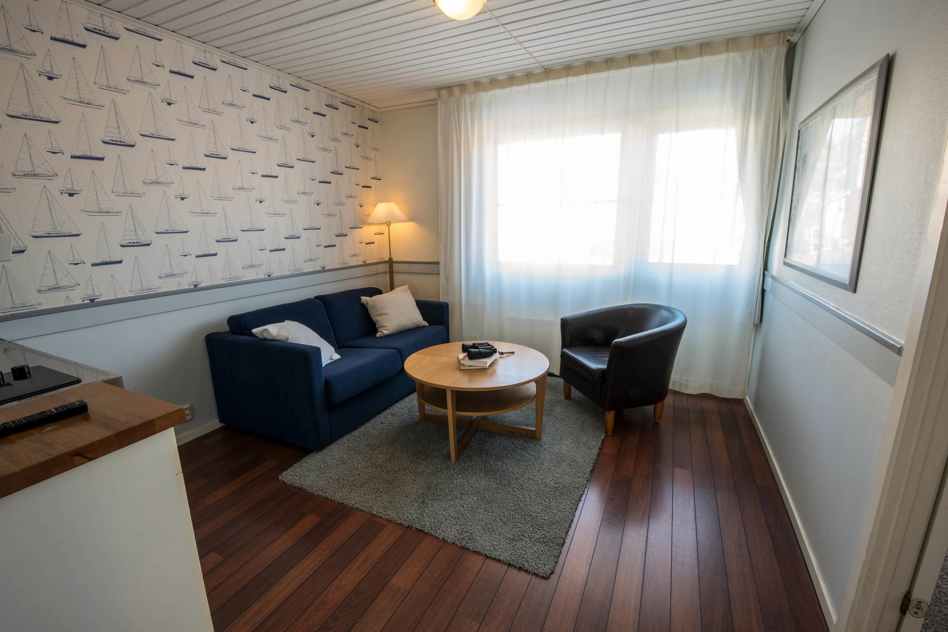 family room | desk, iron/ironing board, cots/infant beds, bed sheets