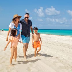 On the beach, white sand, sun-loungers, beach volleyball