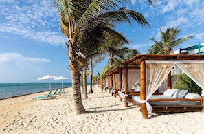 Beach | On the beach, white sand, sun loungers, beach umbrellas