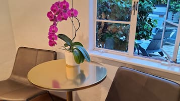 Comfort Room, 1 King Bed, Refrigerator, Courtyard Area | Premium bedding, down duvets, pillow-top beds, iron/ironing board