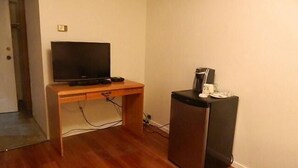 Quarto solteiro standard, 1 cama Queen | Comodidades do quarto