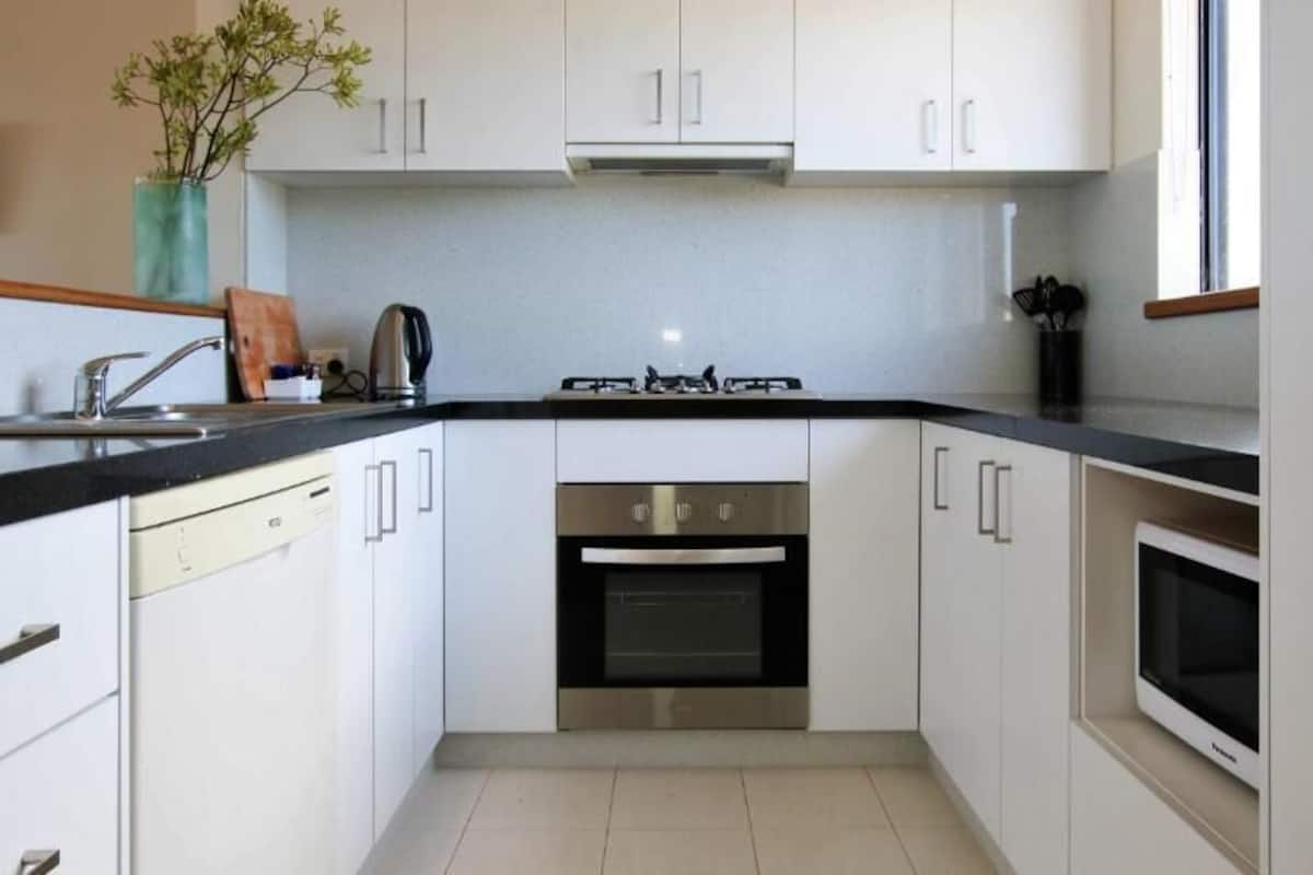 Two Bedroom Townhouse | Private kitchen | Fridge, microwave, stovetop, coffee/tea maker