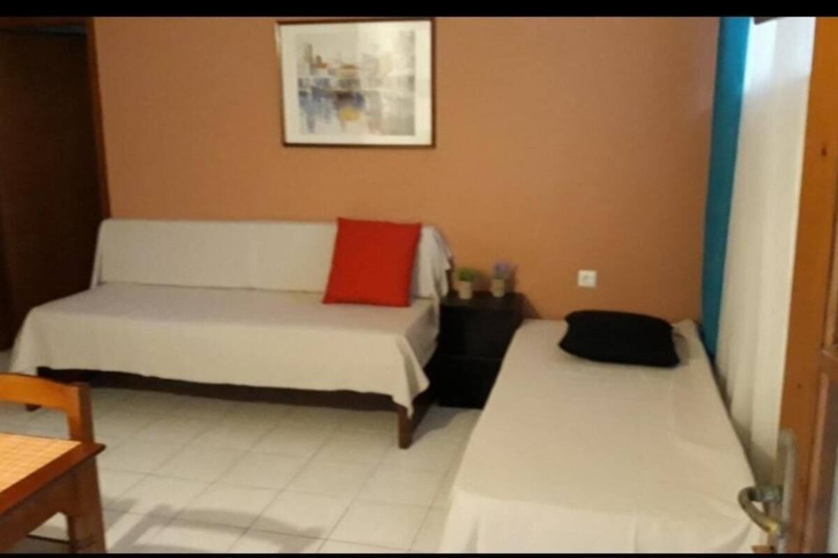 economy semi-basement apartment | living room | tv