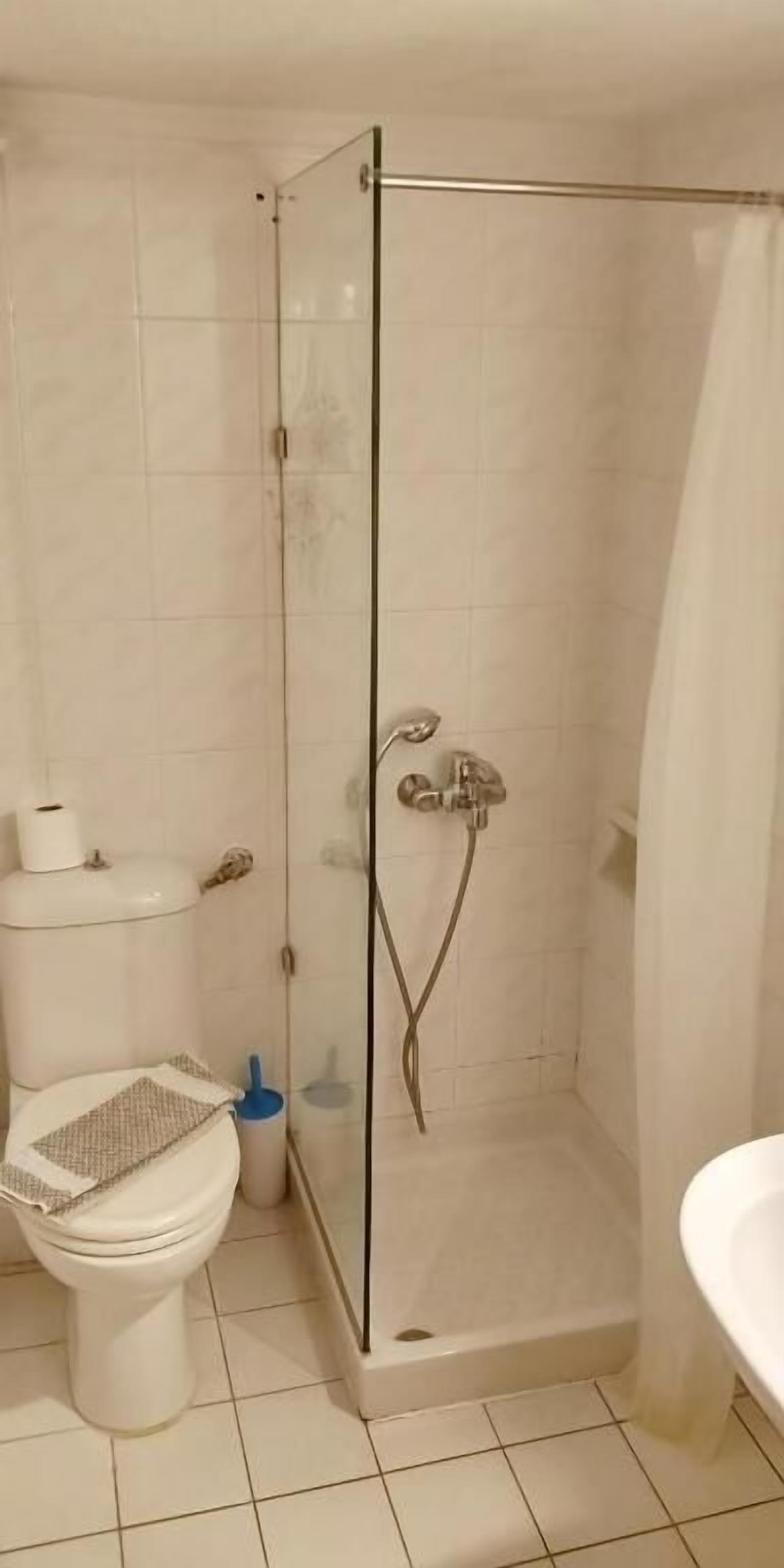 economy semi-basement apartment | bathroom | shower, hair dryer, towels