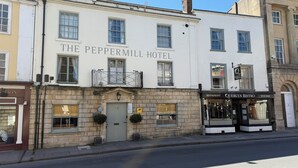 The Peppermill Hotel with a classic facade, a prominent entrance, and adjacent Quercus Bistro. - The Peppermill (Devizes)