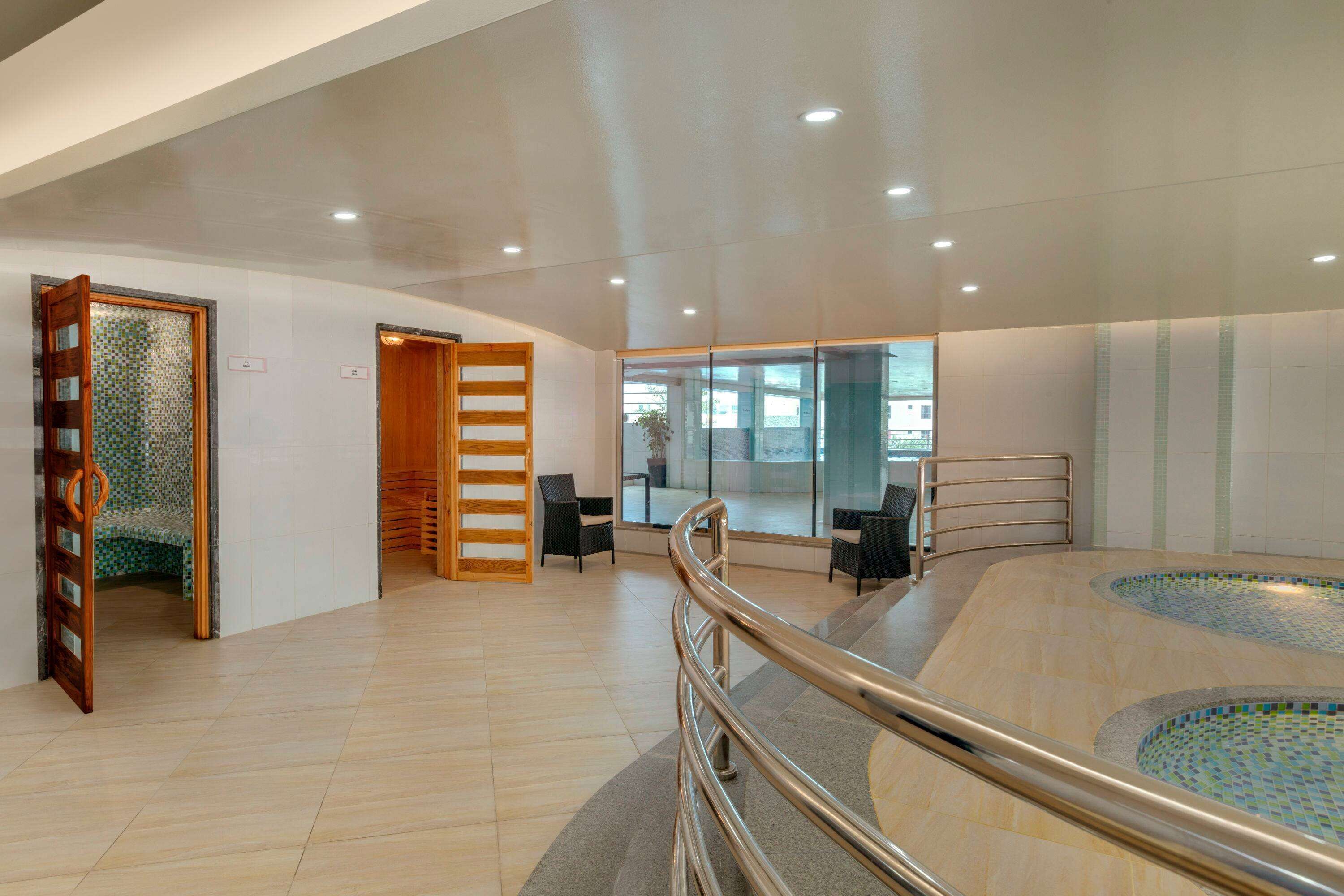 outdoor pool, pool loungers, lifeguards on site