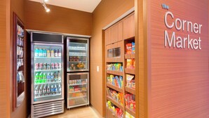A corner market with refrigerated beverage dispensers and snack shelves. - Fairfield Inn & Suites Pittsburgh Airport/Robinson Township (Pittsburgh)