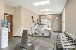 A gym with exercise equipment, a water dispenser, and a bench. - Fairfield Inn & Suites Pittsburgh Airport/Robinson Township (Pittsburgh)