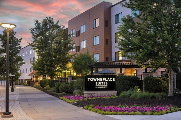 A modern hotel with a sign reading "Towneplace Suites by Marriott," surrounded by landscaped gardens and trees. - TownePlace Suites Minneapolis near Mall of America (Bloomington)