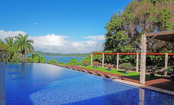 Outdoor pool, open 7:00 AM to 10:00 PM, pool loungers