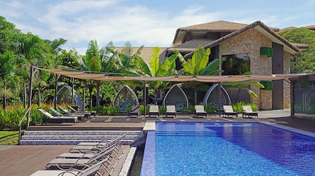 Outdoor pool, open 7:00 AM to 10:00 PM, sun loungers