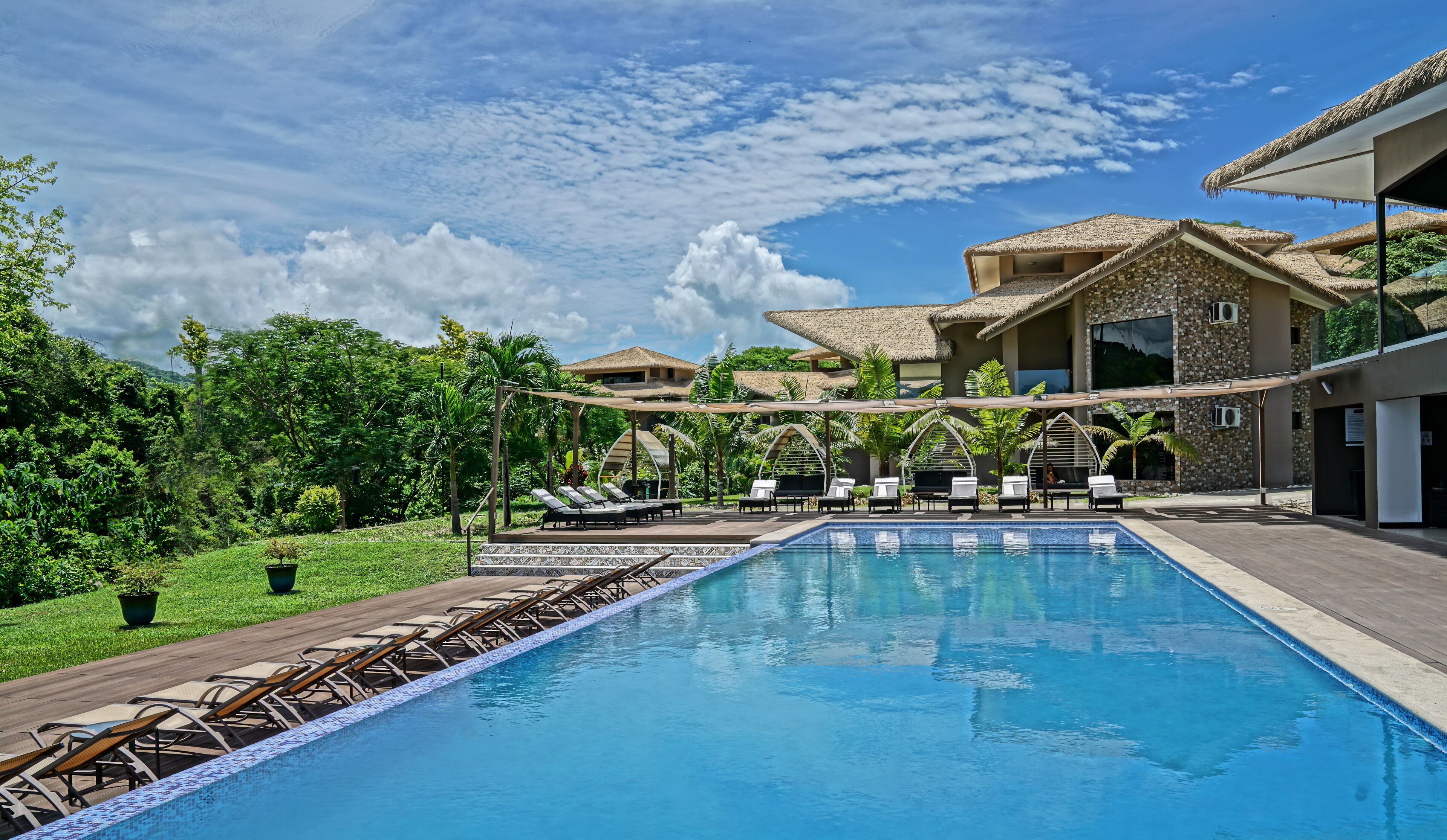 Outdoor pool, open 7:00 AM to 10:00 PM, sun loungers