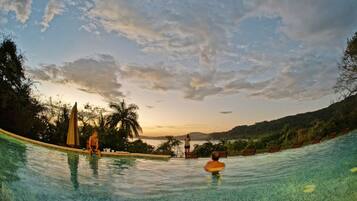 Outdoor pool, open 7:00 AM to 10:00 PM, pool loungers