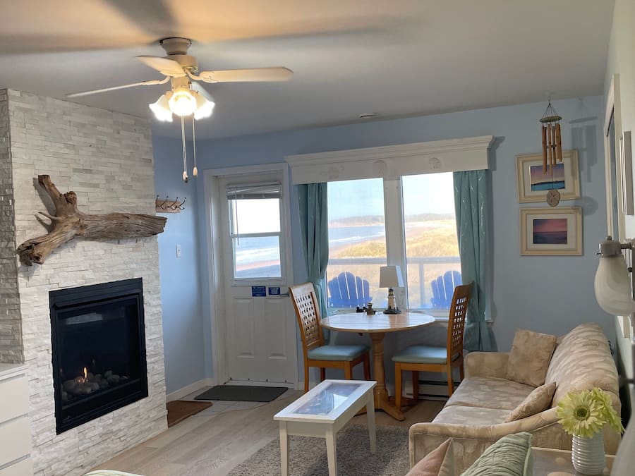 Deluxe Studio, 1 Queen Bed, Kitchenette, Ocean View | Living area | TV, fireplace, DVD player