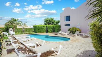 Outdoor pool, open 8:00 AM to 8:00 PM, sun loungers