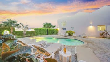 Outdoor pool, open 8:00 AM to 8:00 PM, sun loungers