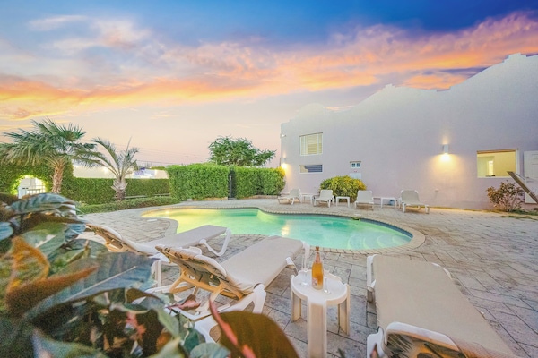 Outdoor pool, open 8:00 AM to 8:00 PM, sun loungers