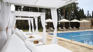 Indoor pool, outdoor pool, pool umbrellas, pool loungers