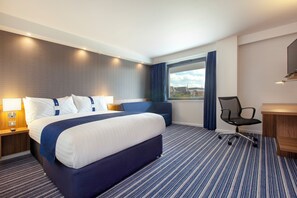 A hotel room with a large bed, a desk, a chair, and a window with curtains. - Holiday Inn Express Middlesbrough - Centre Square by IHG (Middlesbrough)