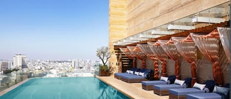 Outdoor pool, open 6:00 AM to 8:00 PM, sun loungers