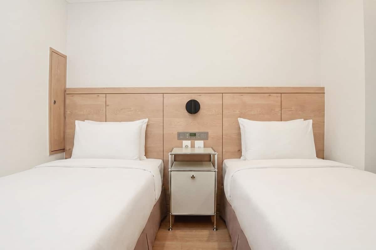 Standard Twin Room | Down comforters, in-room safe, desk, blackout drapes