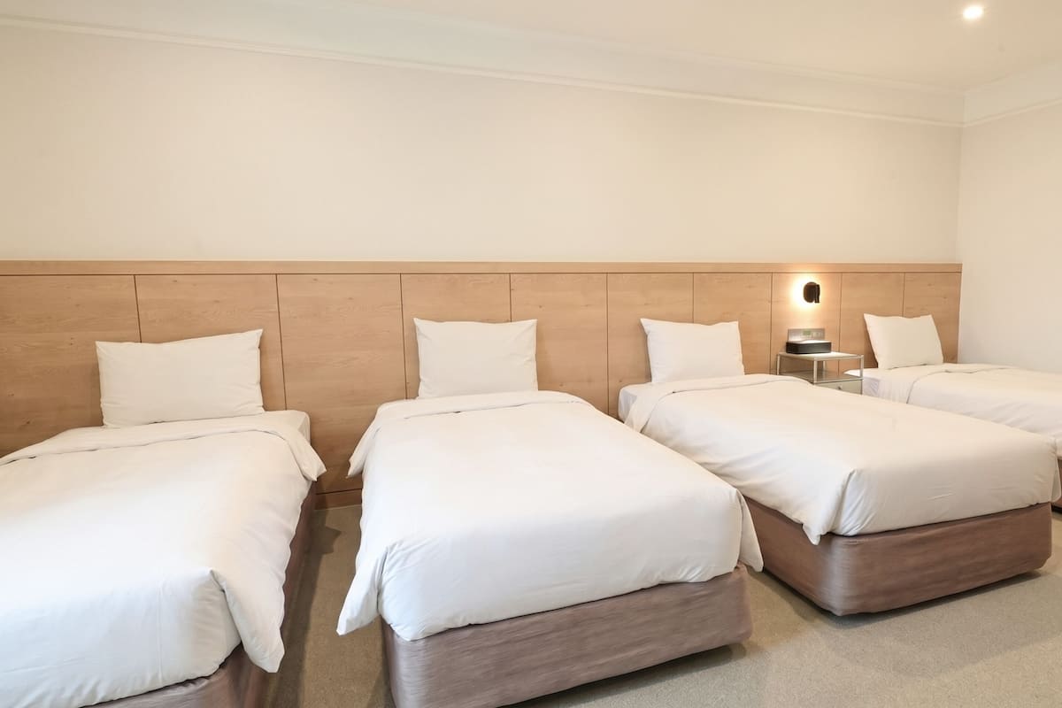 Quadruple Room | Down comforters, in-room safe, desk, blackout drapes
