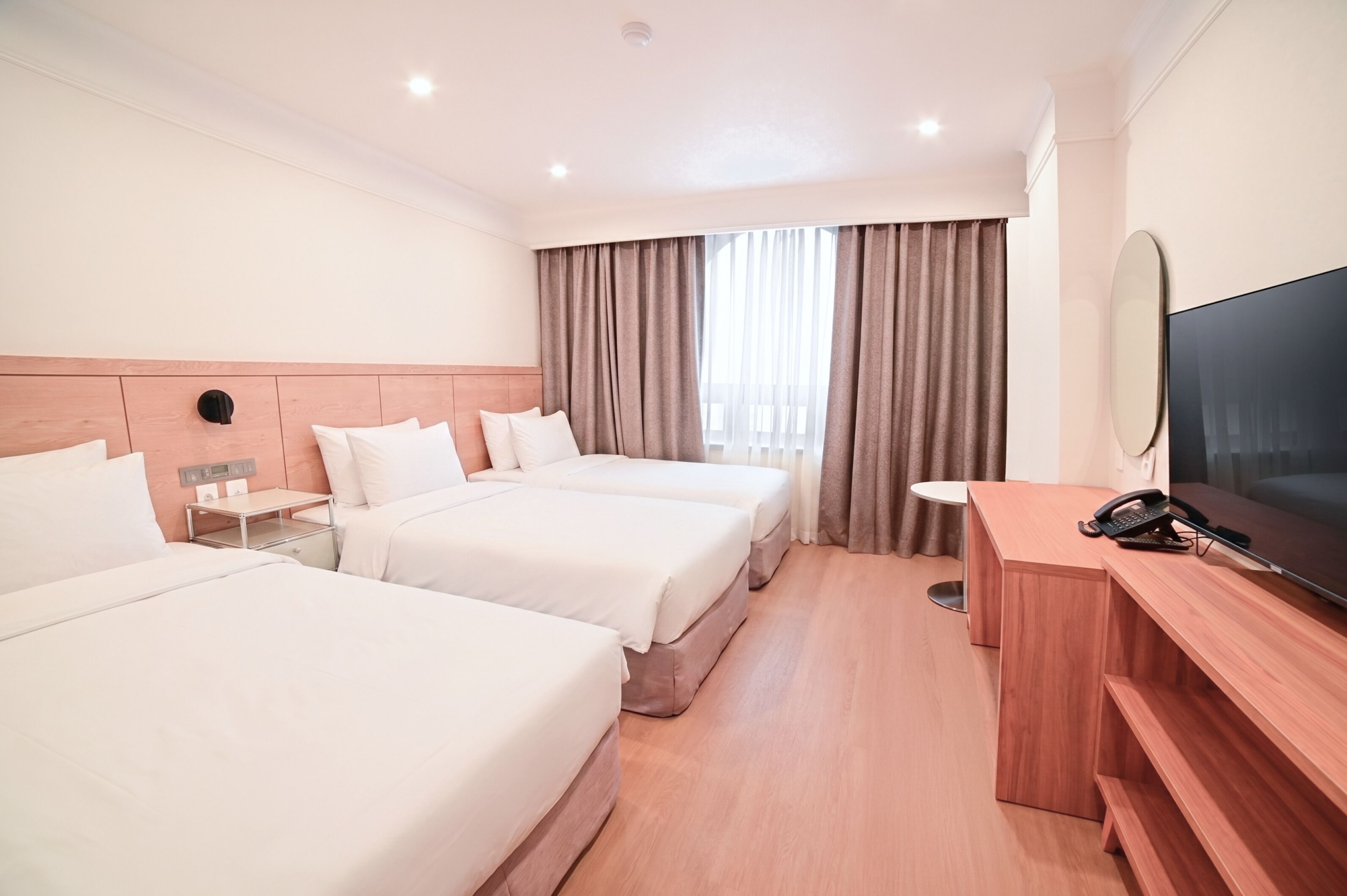 Deluxe Triple Room, 3 Single Beds, Pets not allowed, City View | Down duvets, in-room safe, desk, blackout curtains