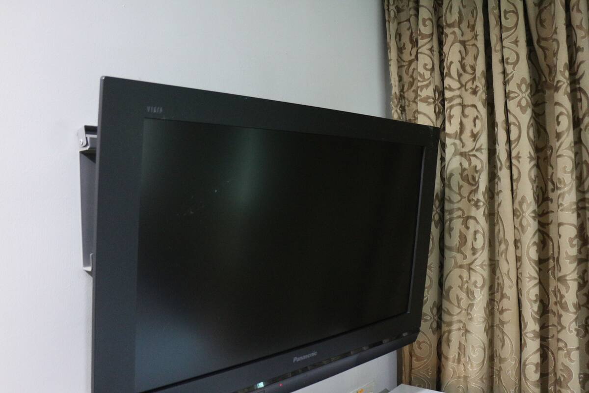 A flat-screen TV mounted on a wall.