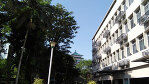 A modern building with a white facade and multiple balconies. - Telang Usan Hotel (Kuching)