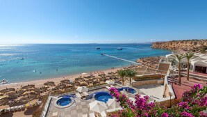 A resort with a pool area, beach, and views of the sea. - SENTIDO Reef Oasis Aqua Park Resort - All inclusive (Sharm El Sheikh)