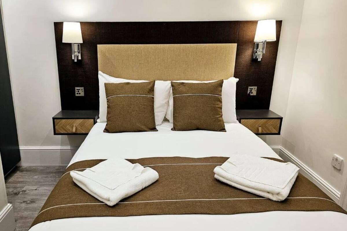 Deluxe maisonnette, keuken | Een strijkplank/strijkijzer, gratis wifi, beddengoed