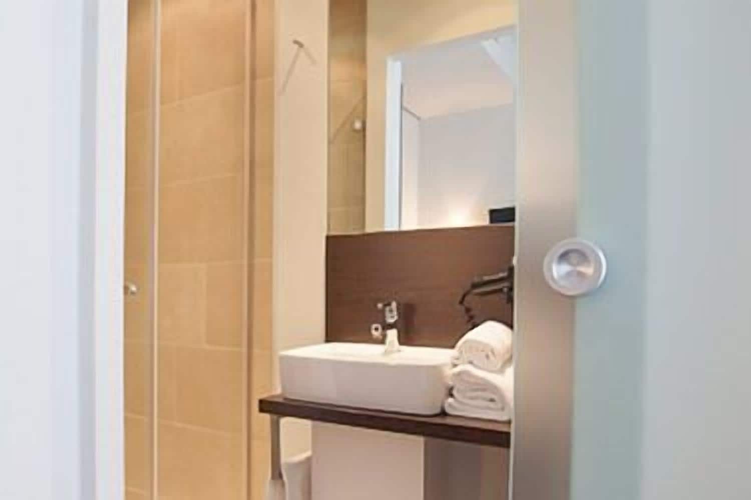 shower, free toiletries, slippers, towels