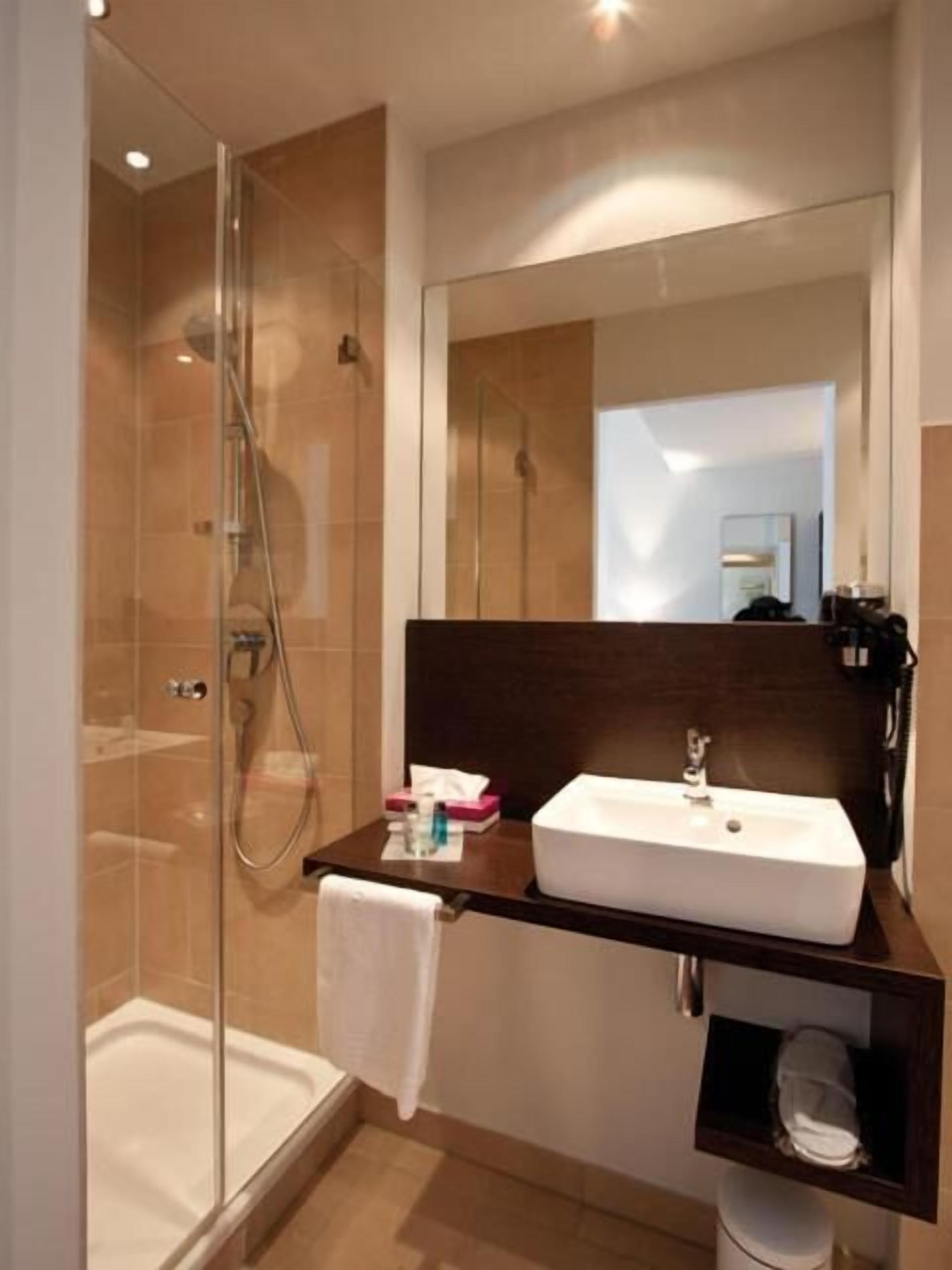 shower, free toiletries, slippers, towels