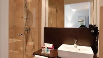 Shower, free toiletries, slippers, towels